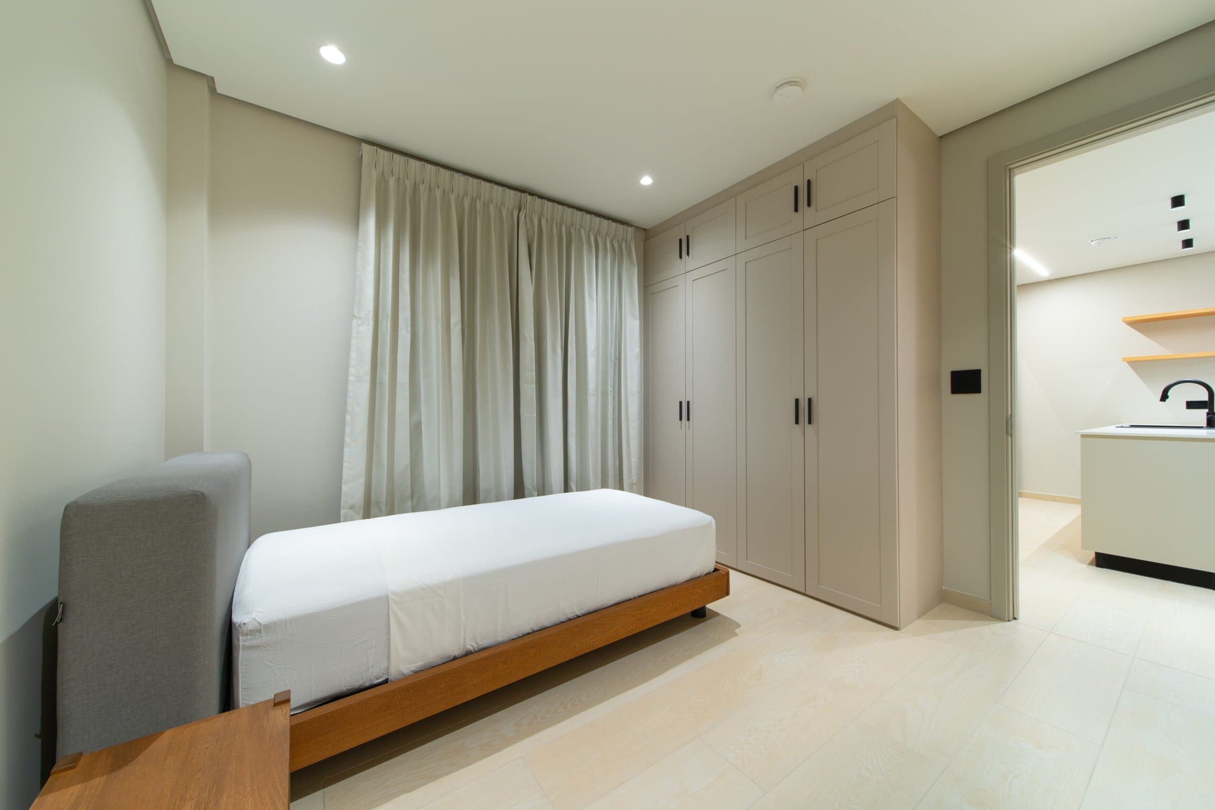 Bedroom with built-in wardrobe in a Pinoalto condo-suite