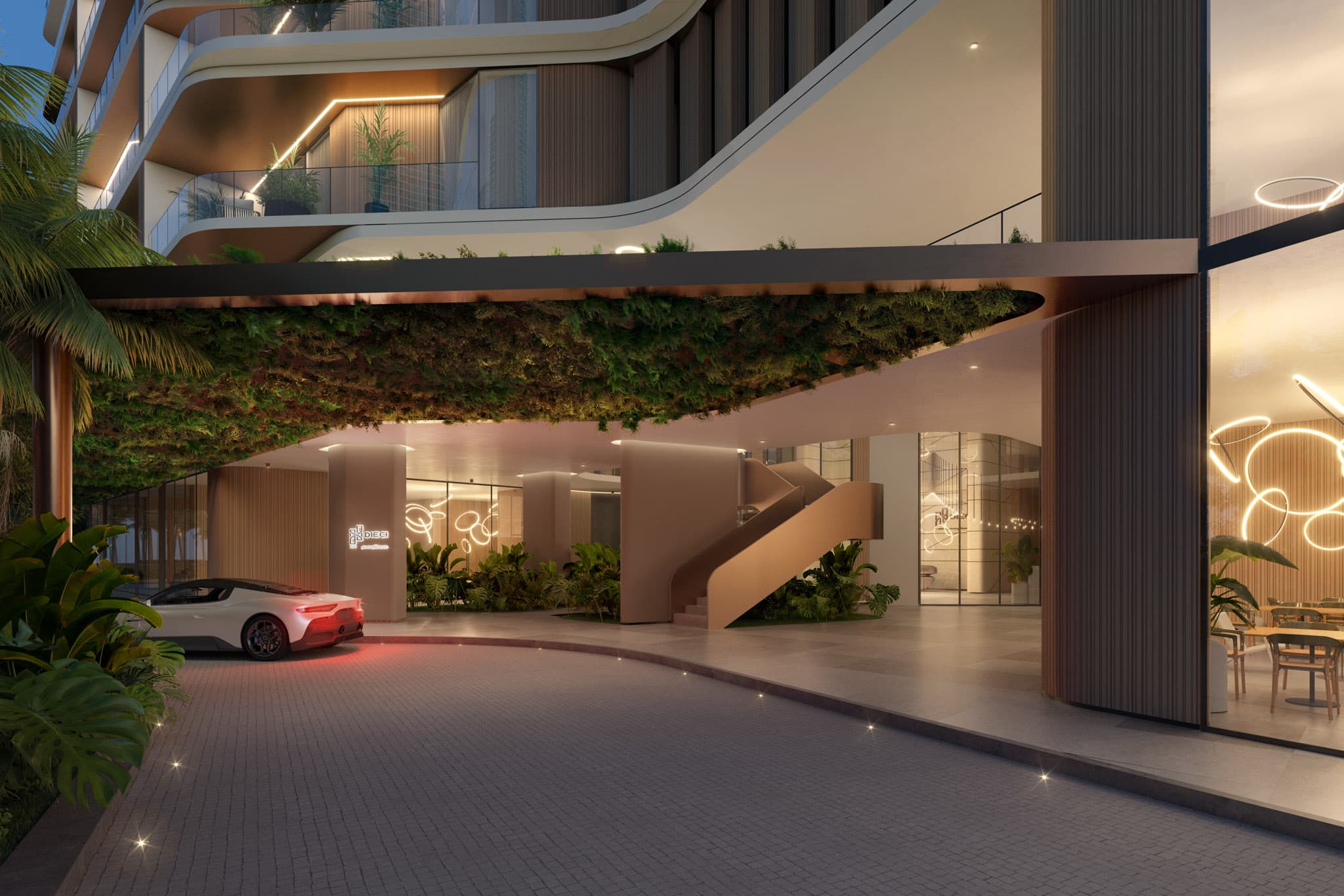 Covered drop-off and lobby entrance at DIECI at dusk